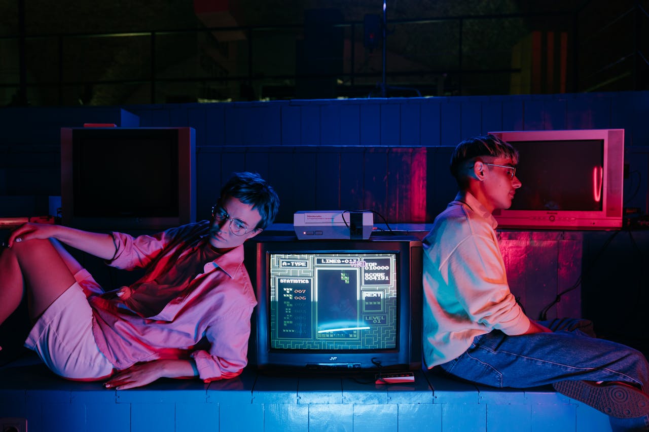 Teenagers enjoying retro gaming on vintage screens with neon lights. Nostalgic 80s vibe.